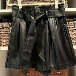 Black faux leather shorts by Zara